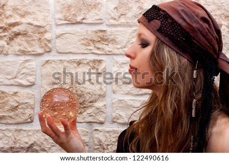 Side view of a pretty female fortune teller