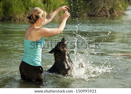 pretty woman in water animated dog to play