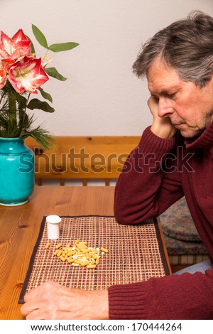 portrait of a elderly man with medications