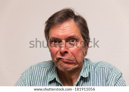 funny senior citizen is making a grimace