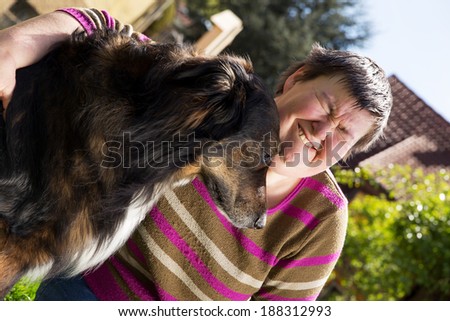 disabled woman sitting outdoors with an half breed dog