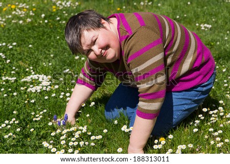 mentally disabled woman on a meadow