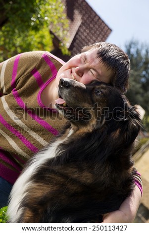 mentally disabled woman cuddles a dog