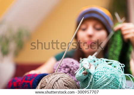 closeup of wool with a woman in the background