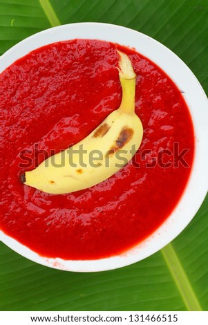 Banana on strawberry sauce