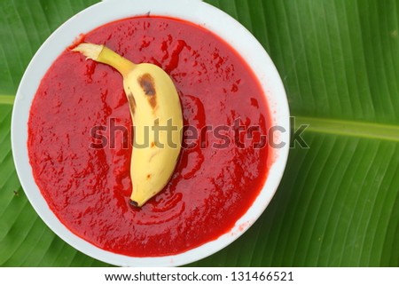 Banana on strawberry sauce