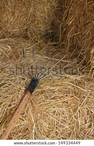 Hay bales with tools at farm