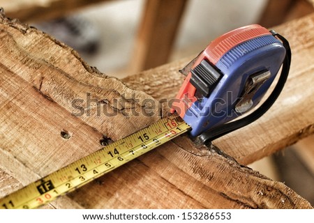 Measuring tape on the wood