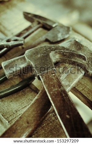 Hammer and tool on wood