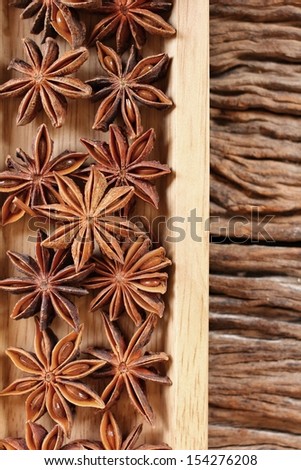 Star anise on wood background