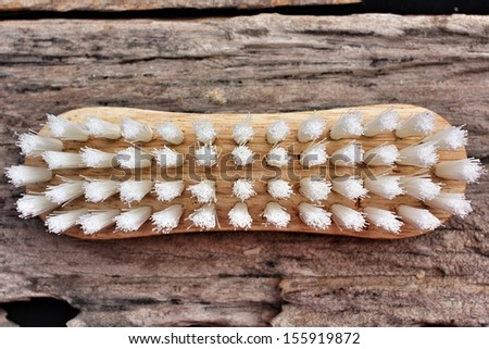 clothes cleaning brush on wood