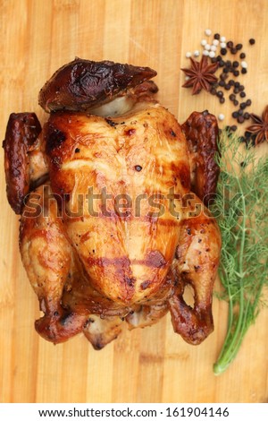 Whole roasted chicken with fresh vegetables for thanksgiving day