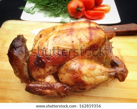 Whole roasted chicken with fresh vegetables for thanksgiving day