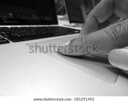 Hands touch on notebook
