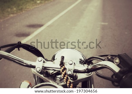 Driver riding motorcycle on the road