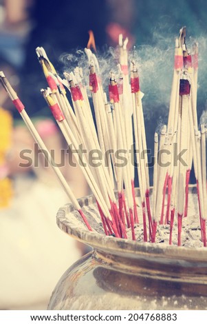 Incense sticks burning at temple
