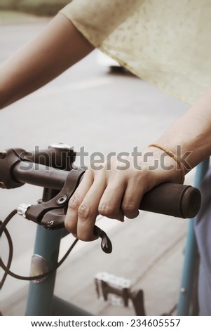 Hand with bike