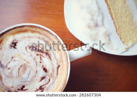 Vintage latte coffee with cake