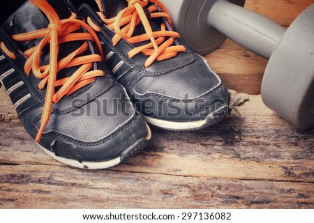 Sports set of sneakers with dumbbell