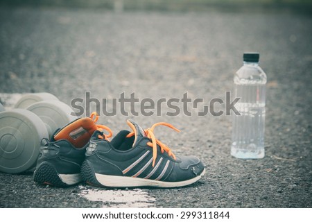 Sports set of water drink sneakers with dumbbells