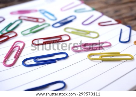 Paper notes with colorful paper clips