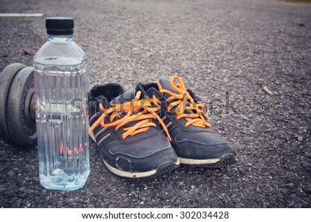 Sports set of water drink sneakers with dumbbells