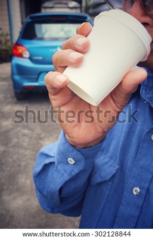 Man drink coffee paper cup