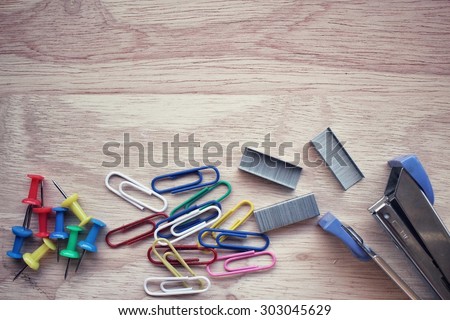 Stapler and staples with paper clip