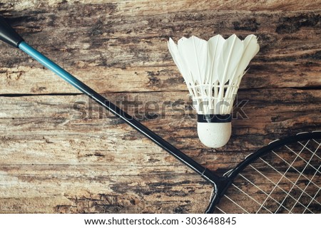 Shuttlecocks with badminton racket.