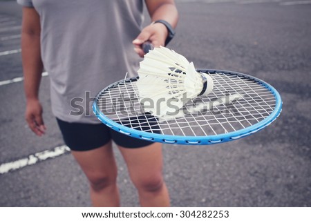 Young female player badminton