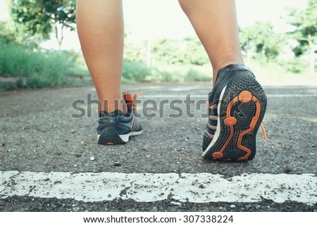 Woman with shoes running