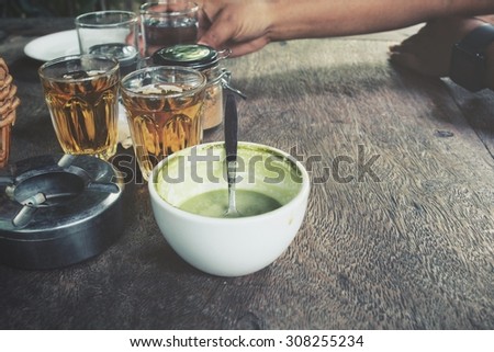 Drinking green tea and milk