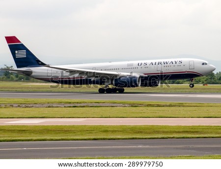 Manchester, United Kingdom - June 14, 2014: US Airways Airbus A330 taking off from Manchester Airport. US Airways has extended it\'s jet maintenance lease at Pittsburgh Airport for another five years.