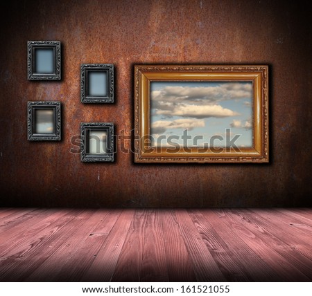 beautiful interior backdrop with antique painting frames on rusty wall