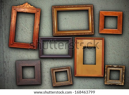 Lots Of Empty Picture Frames Hung On Green Wall Ready For Your Design