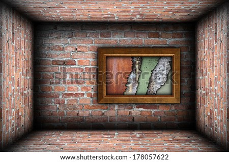 painting frame with weathered textures on grungy brick wall