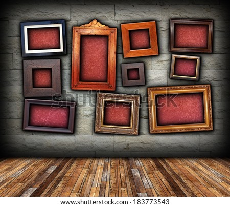 architectural backdrop with frames on stone wall and place for your message, red blank canvas