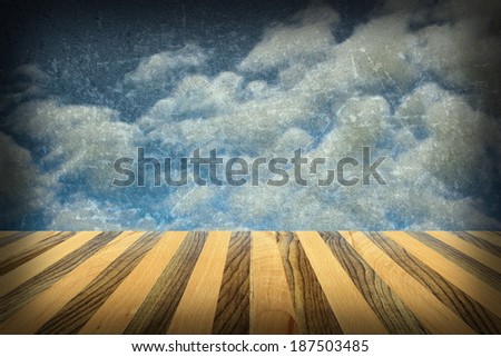 striped wooden terrace backdrop with view to beautiful abstract distressed sky