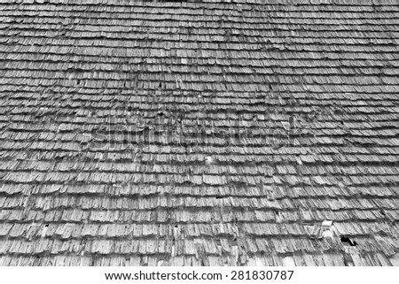 damaged traditional shingle roof, interesting abstract real texture on old romanian  church, black and white
