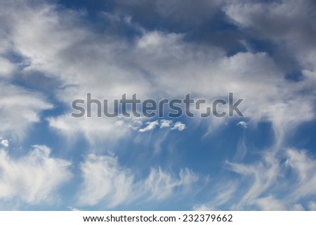 Sunny late day with white clouds of differing shapes and textures in blue sky/Sunny Afternoon Skyscape with White Clouds of Various Formations in Azure Sky/White cloud shapes and sizes in blue sky