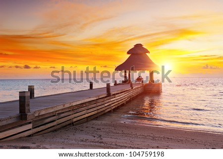 Awesome vivid sunset over the jetty in the Indian ocean, Maldives. HDR
