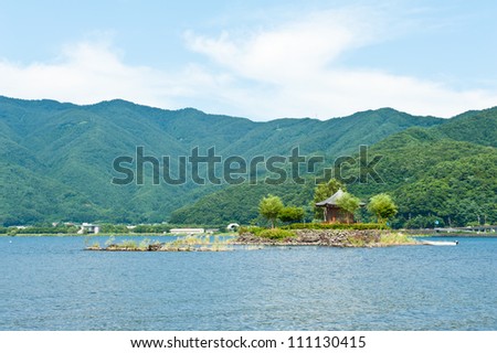 Small gazebo on an island, lake Kawaguchiko under the Mount Fuji, Japan