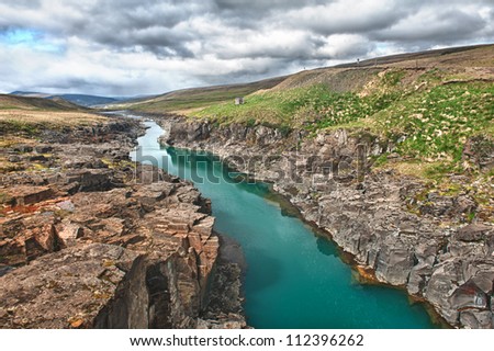 Beautiful turquoise glacial river in a canyon, Iceland