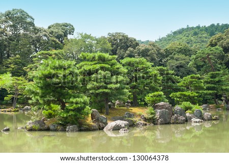 Zen Garden with pines and a pond in Kyoto, Japan