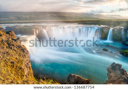 Godafoss is a very beautiful Icelandic waterfall. It is located on the North of the island not far from the lake Myvatn and the Ring Road. This photo is taken after the midnight sunset