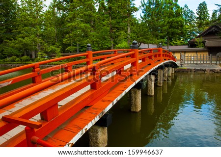 Beautiful traditional red bridge in Japanese Garden, Japan.