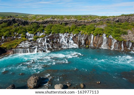 Hraunfossar is a very beautiful Icelandic waterfall in the west of the island. It comes from the lava field and pours into the Hvita river with a incredibly blue water. Long exposure.