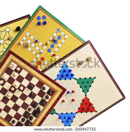 Various board games of ludo, halma, chess and fox and geese isolated on white
