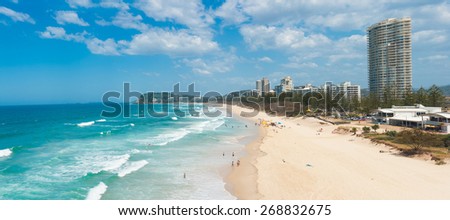Gold Coast with a beach full of tourists seen from above. Queensland, Australia. Panoramic photo