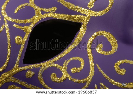 Black hole for the eye of the beautiful Venetian mask with a golden decoration